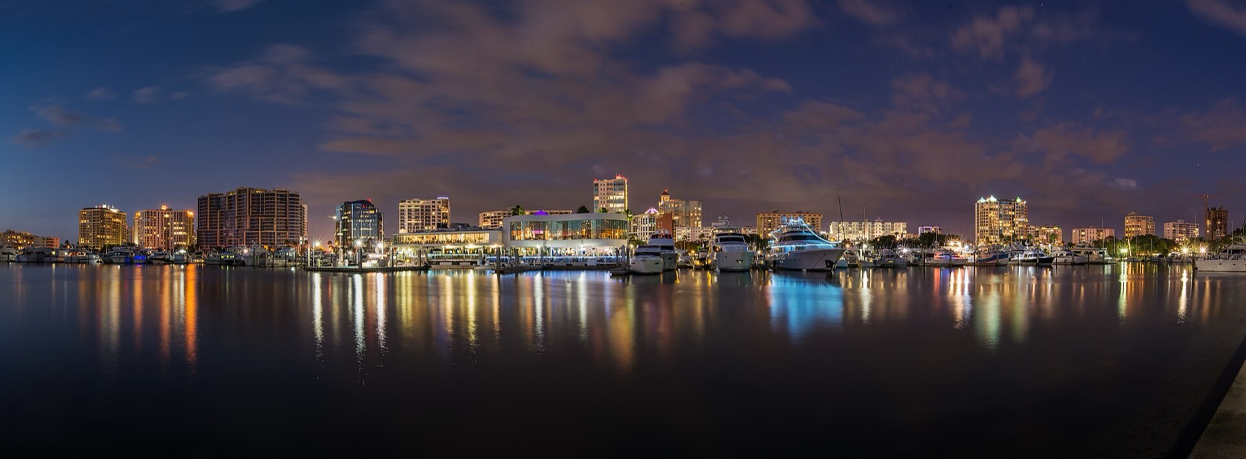 Downtown Sarasota skyline and marina reflected in Sarasota Bay at night