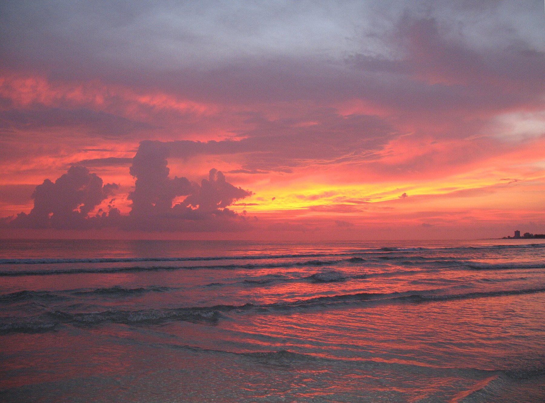 Fiery pink and orange sunset over the Gulf of Mexico at Siesta Key